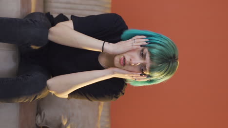 Vertical-video-of-Desperate-young-woman-with-her-hands-on-her-head.-Depressed.